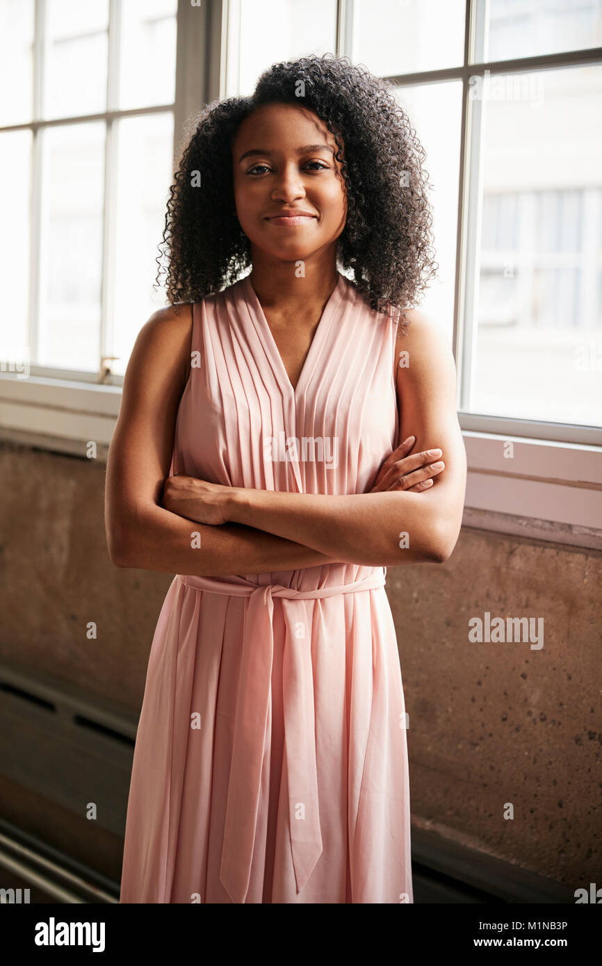 Сheerful african american young woman in summer dress and choker necklace  against black wooden background Stock Photo - Alamy