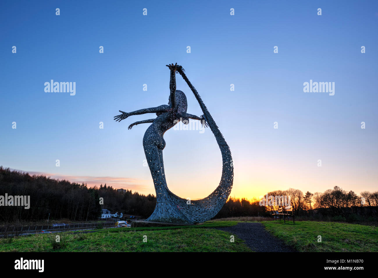 An evening sunset picture of the Arria Sculpture at the side of teh M80 motorway heading north from Cumbernauld. Stock Photo