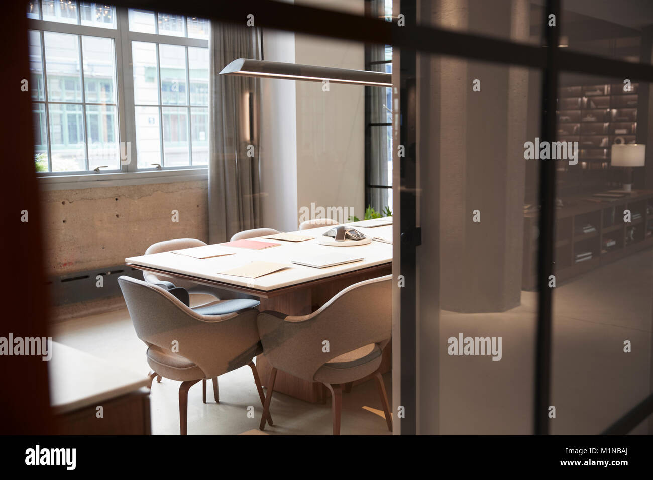 Empty boardroom at a business seen through glass wall Stock Photo