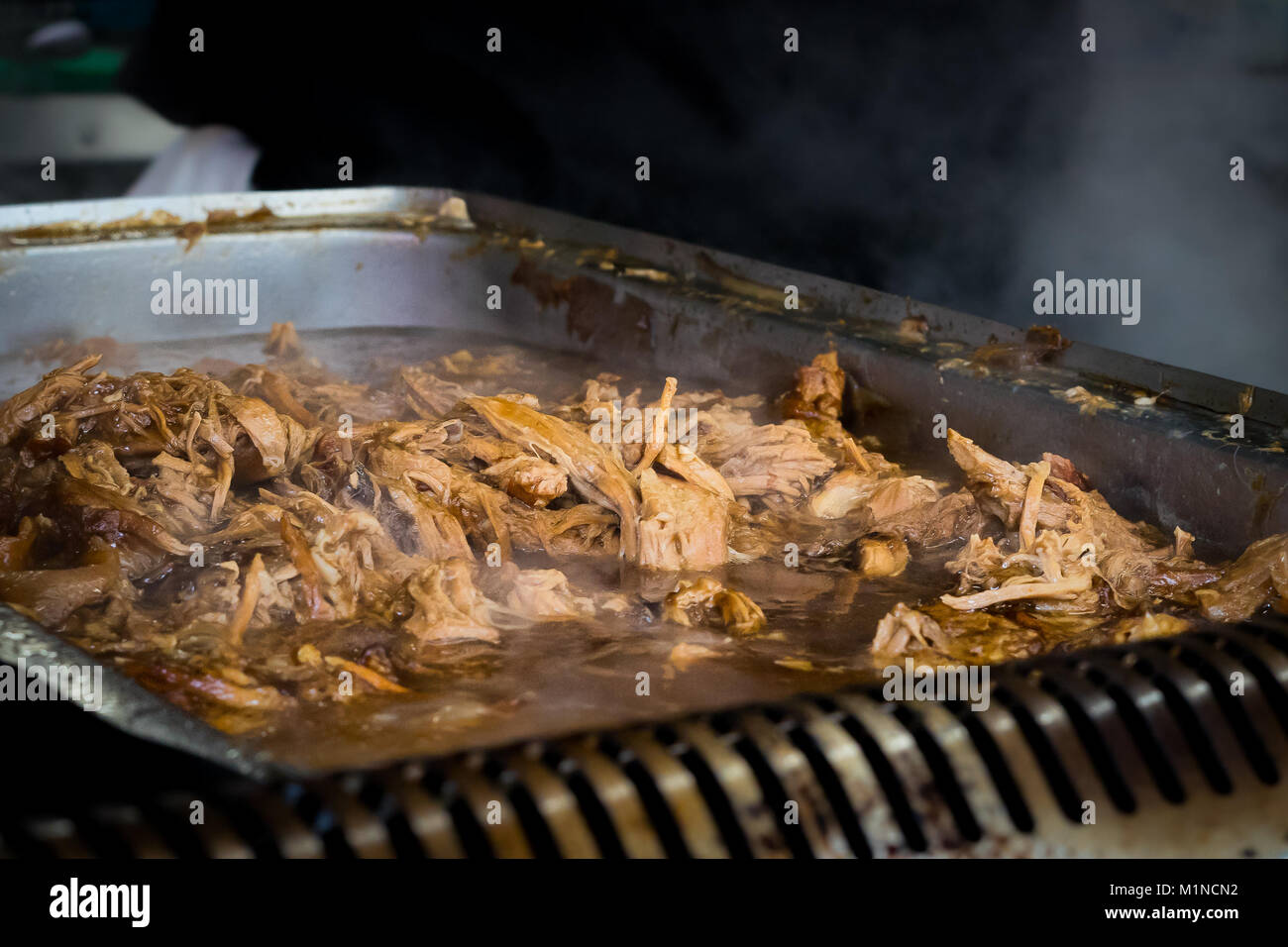 Pulled Pork being cooked in catering van Stock Photo