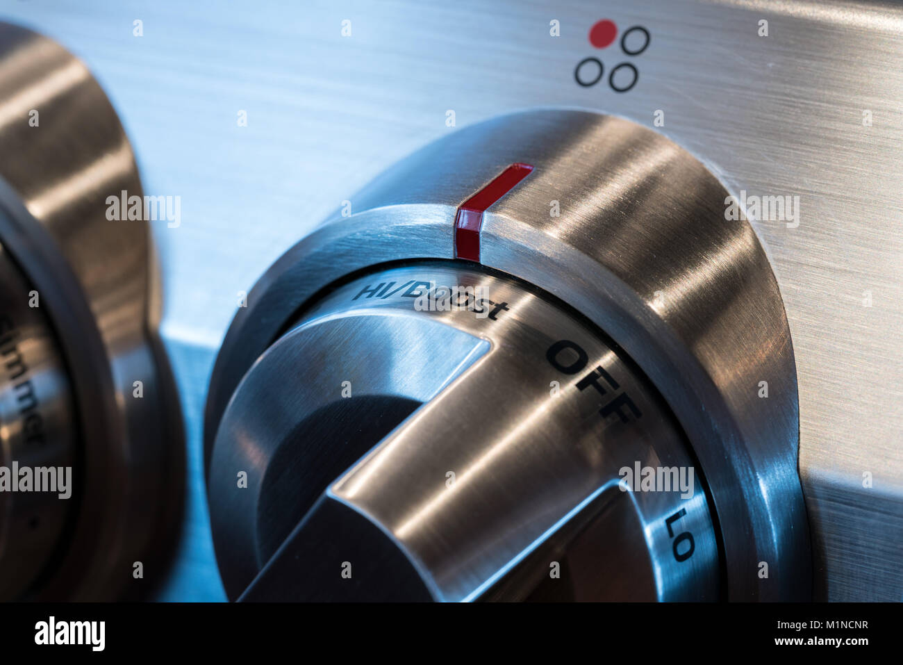 Stainless steel control knob on cooker Stock Photo Alamy
