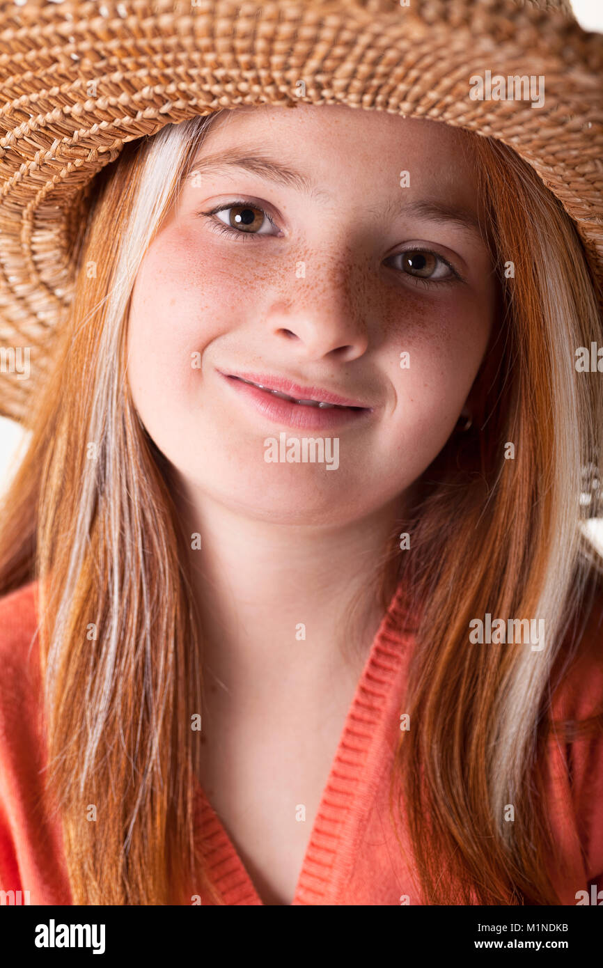 portrait of beautiful freckled young girl wearing straw hat Stock Photo ...