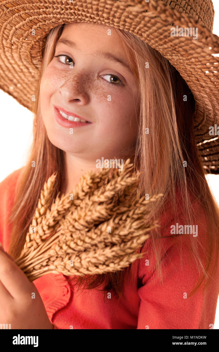 Little girl holding wheat ears in her own hands Stock Photo