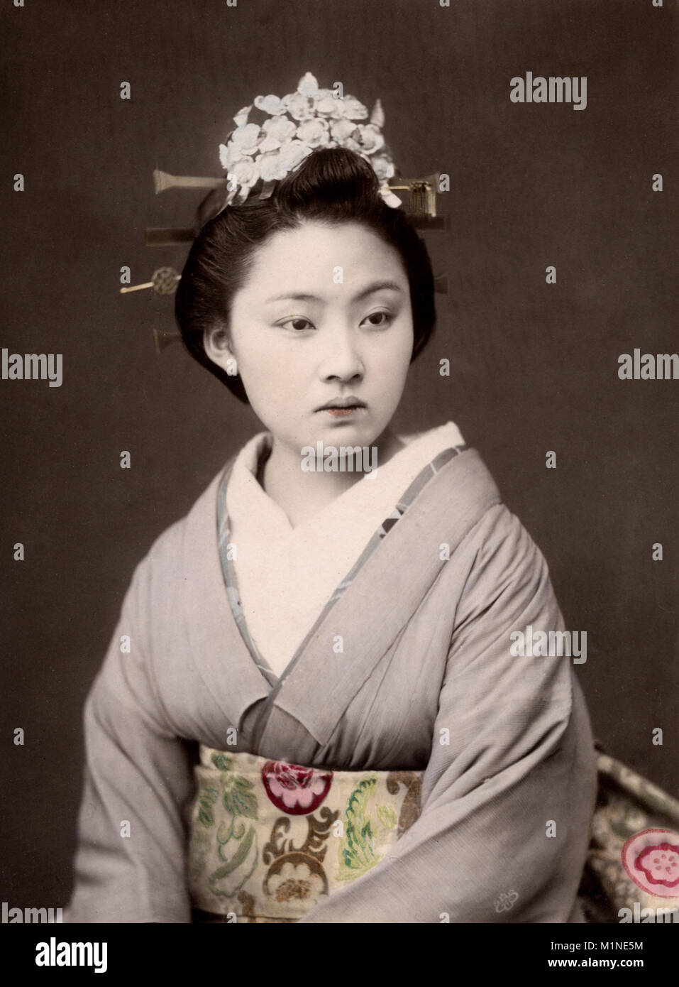 c.1880's Japan geisha with flowers in her hair Stock Photo Alamy