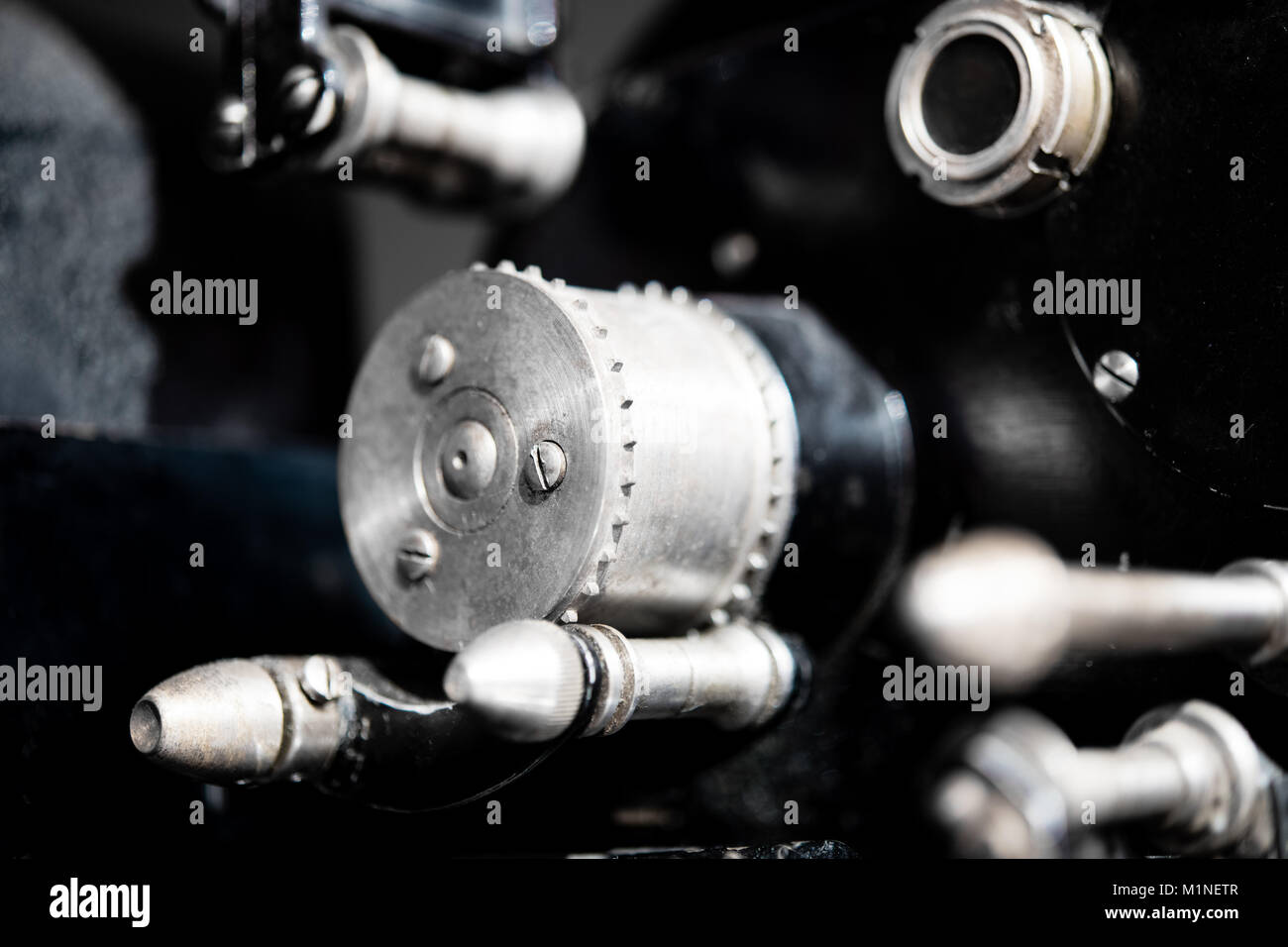 Macro close up of retro vintage movie projector 35mm spool cinema machinery low angle view Stock Photo