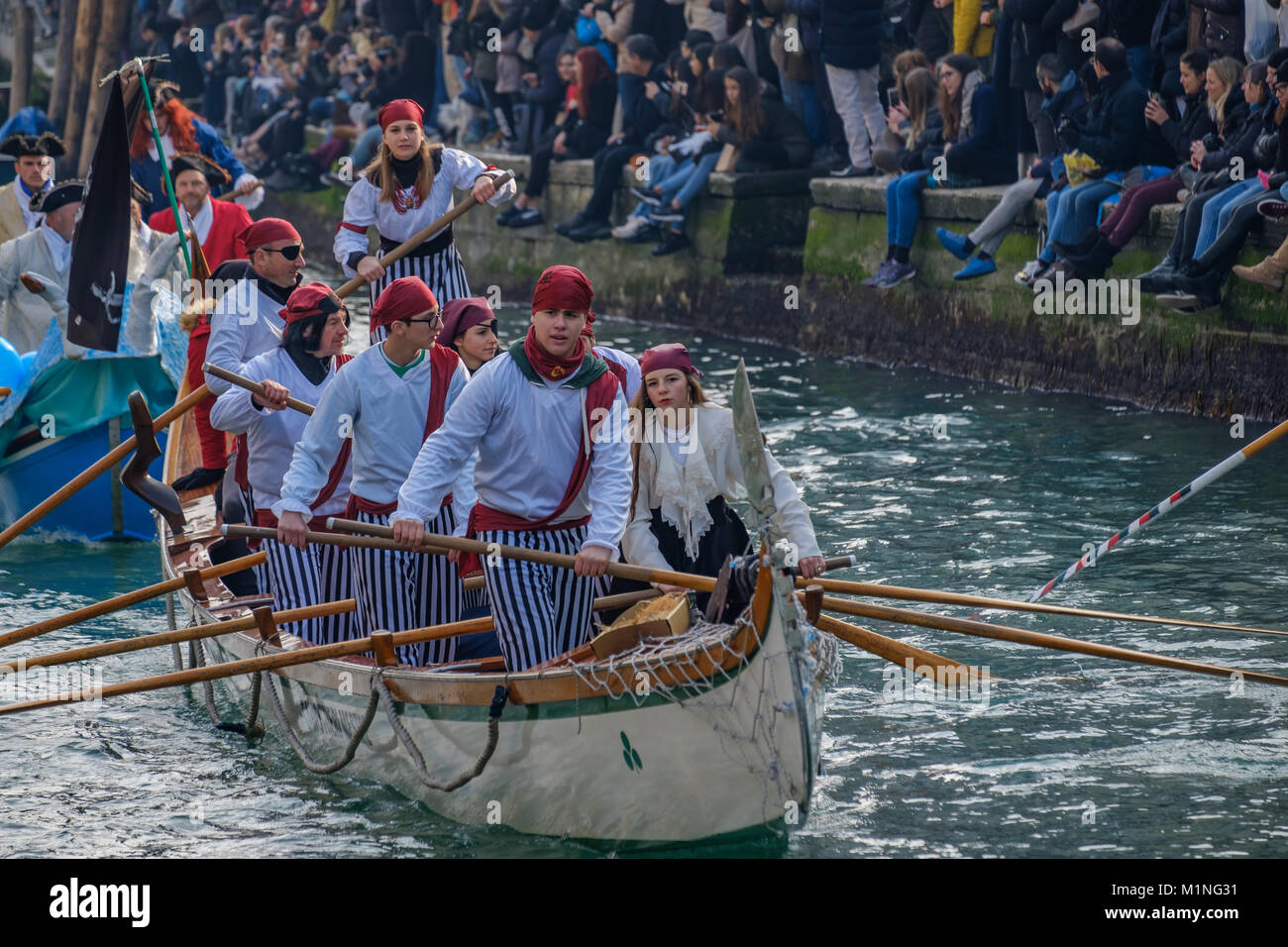 Masquerade water parade in the opening of the Venetian Carnival 2018. Rio di Cannaregio. Venice, Italy. January 28, 2018. Stock Photo