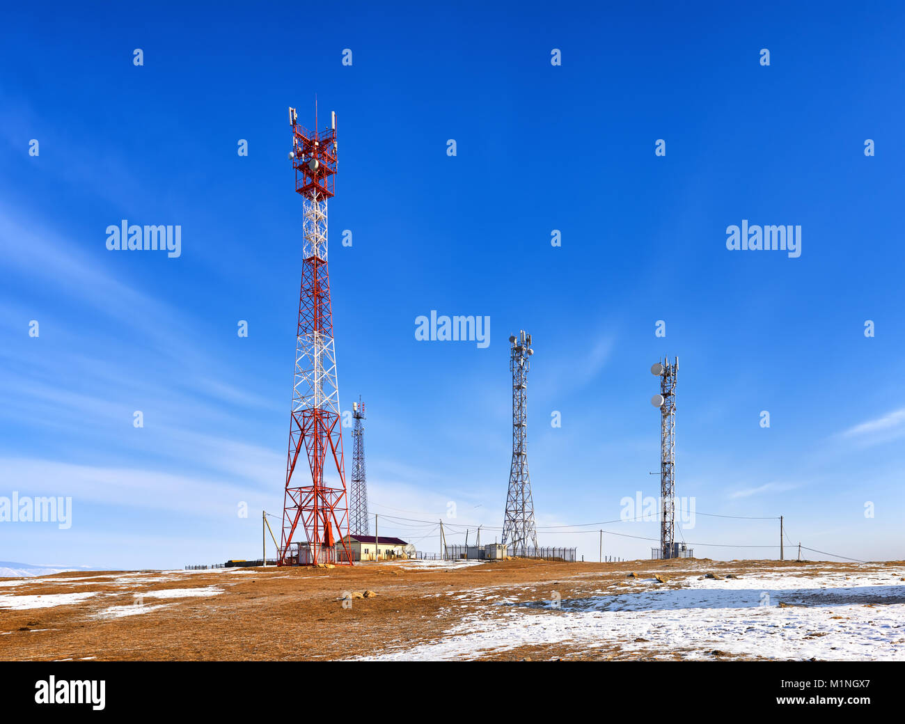 Base transceiver station of cellular communication and mobile Internet. High steel masts with long range equipment. Olkhon Island. Irkutsk region. Rus Stock Photo