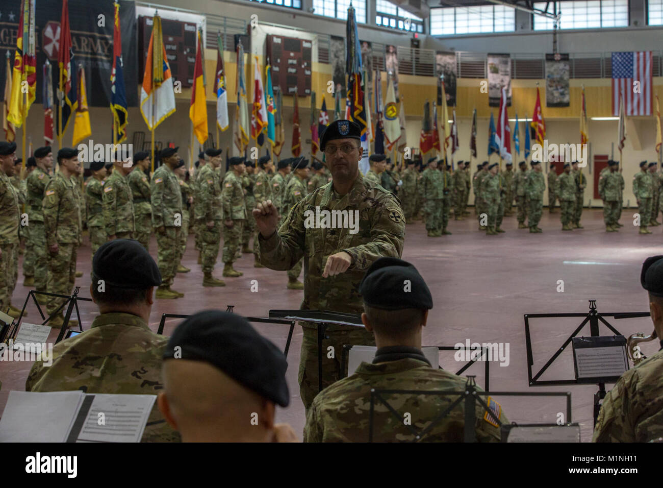 U.S. Army Lt. Col. Treg Ancelet, Eighth Army band conductor, leads the Eighth Army Band through playing of the Eighth Army Song and the Army Song at Camp Humphreys during the Eighth Army change of command ceremony in South Korea, Jan. 5, 2018. Lt. Gen. Thomas S. Vandal relinquished command to Lt. Gen. Michael A. Bills as the new commanding general of Eighth Army. (U.S. Army Stock Photo