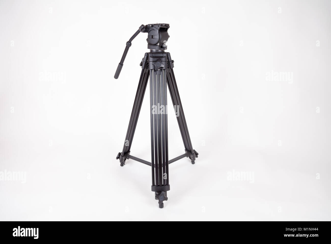 black camera tripod on white background Stock Photo - Alamy