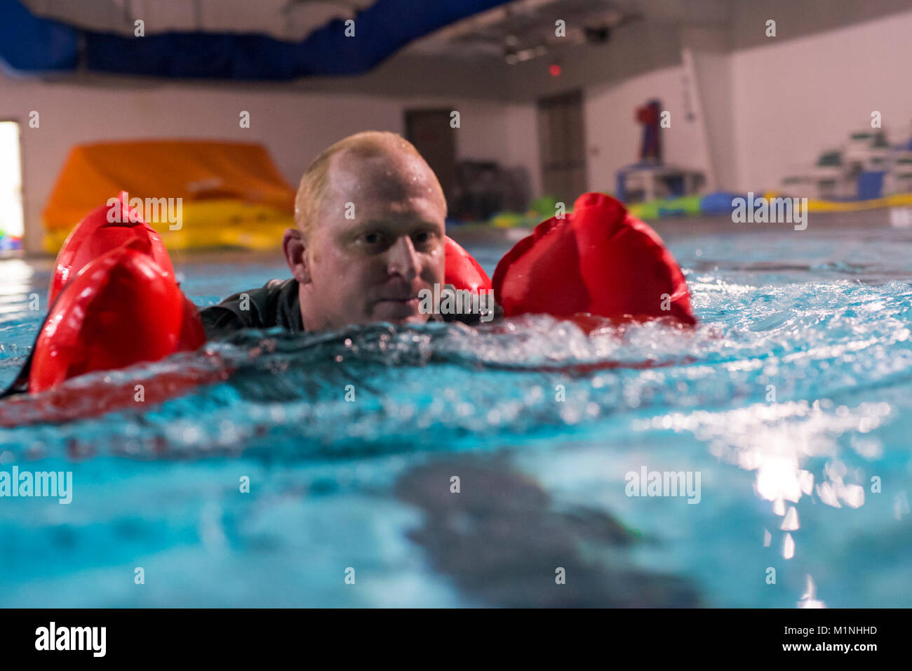 Lt. Col. Clinton Mintz, 71st Rescue Squadron HC-130J Combat King II pilot, swims in a pool, Jan. 19, 2018, at Moody Air Force Base, Ga. Aircrew members participated in an underwater survival course to prepare themselves for a situation in which their aircraft were to crash in the water. (U.S. Air Force Stock Photo