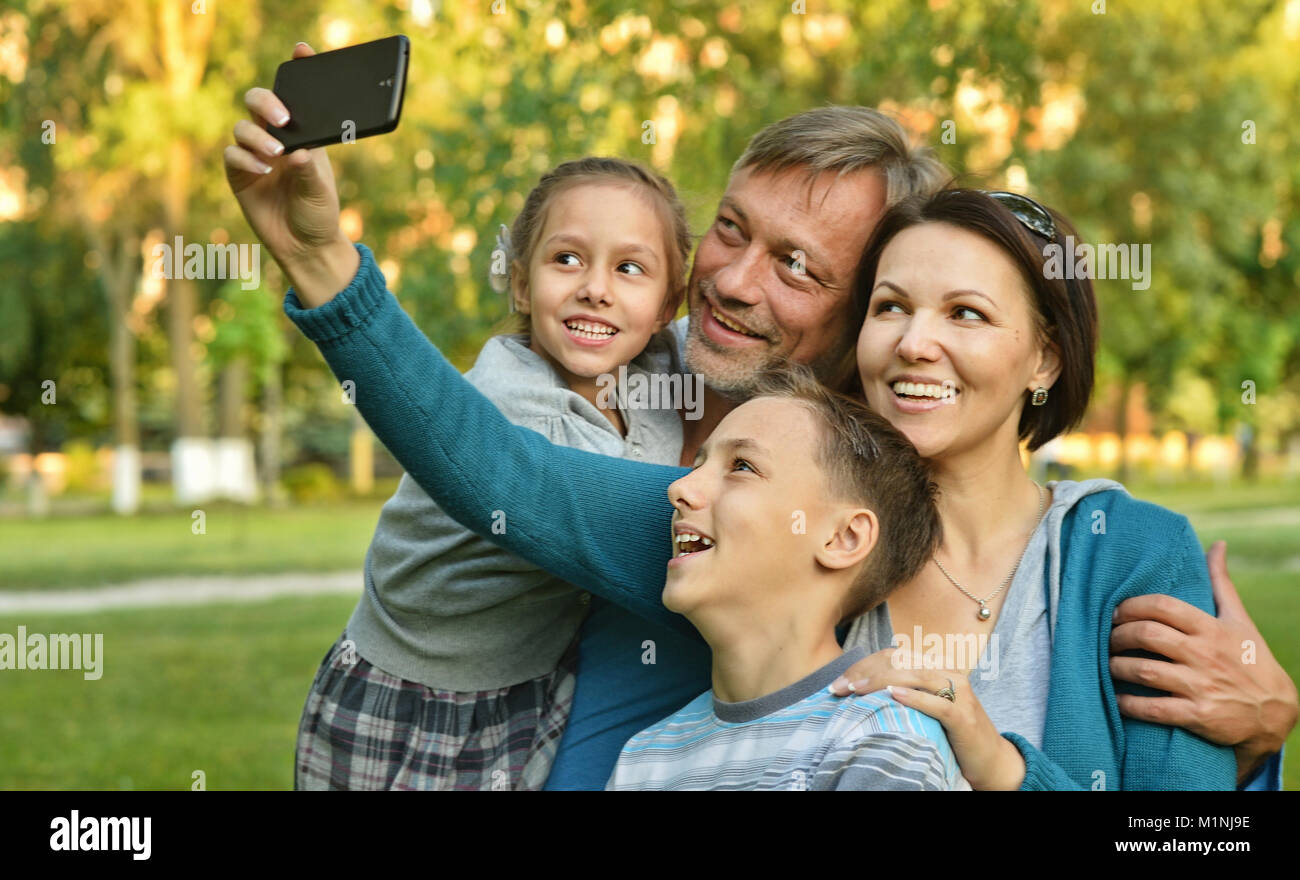 family taking selfie in park Stock Photo