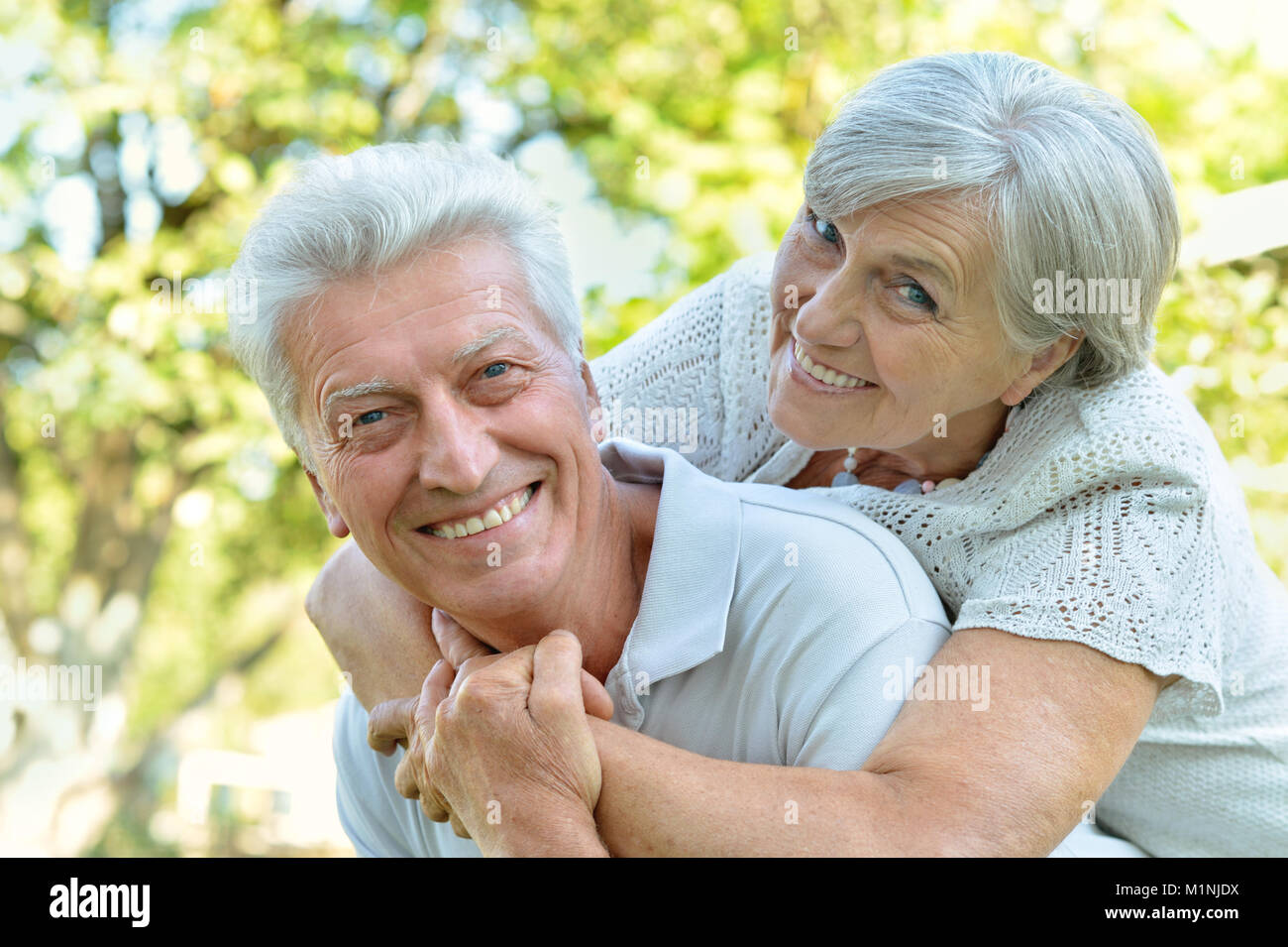 caucasian senior couple in the park Stock Photo - Alamy