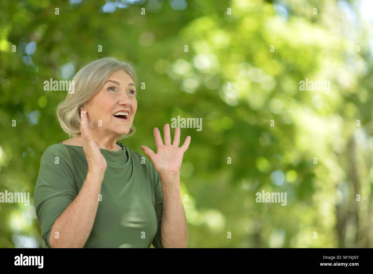 Cheerful middle age woman grey hi-res stock photography and images - Alamy