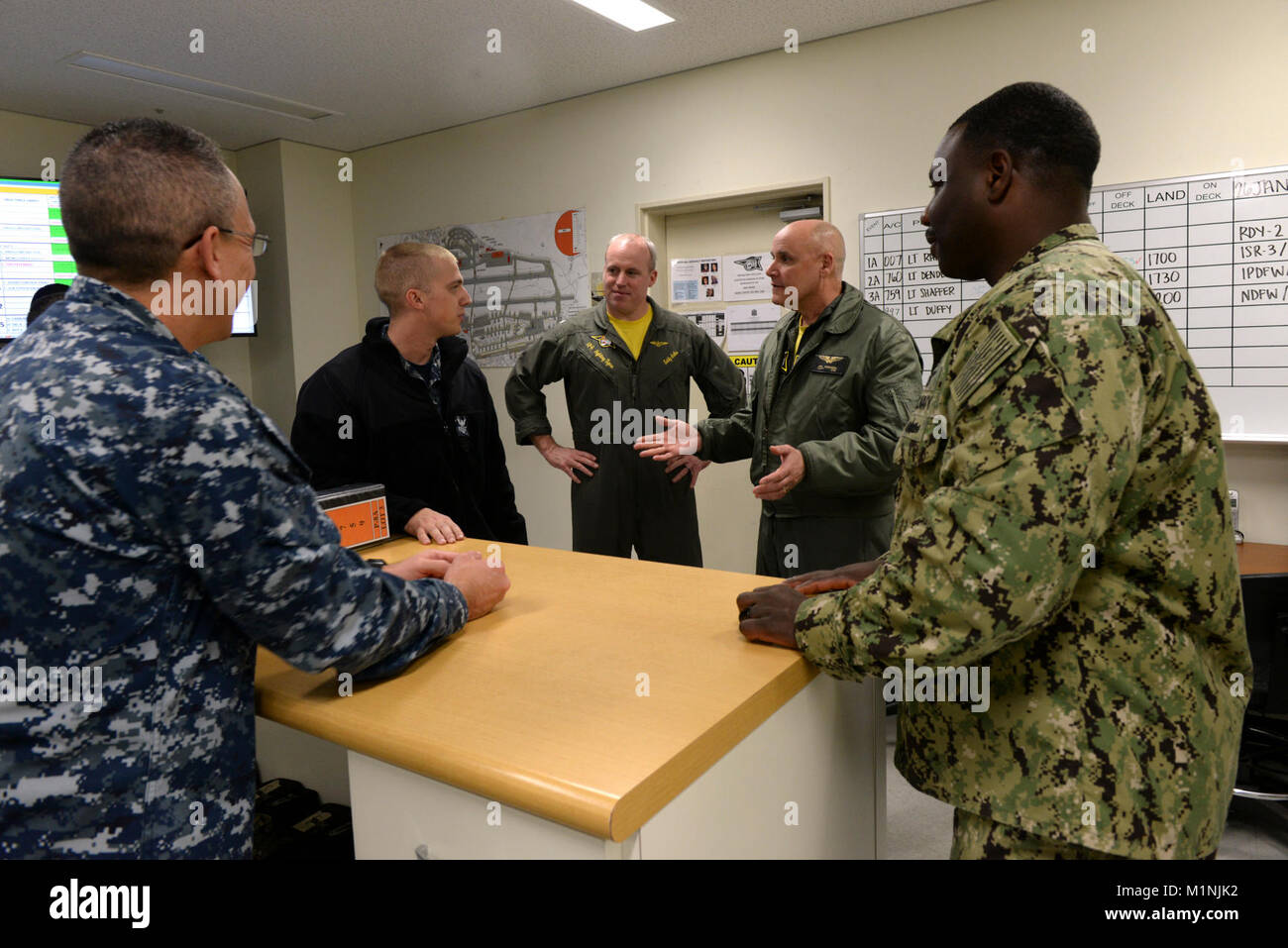 OKINAWA, Japan (Jan. 26 , 2018)  Patrol and Reconnaissance Wing Eleven Commodore Captain James W. Robinson,  talks to The Fighting Tigers Maintenance Control, during a tour of Patrol Squadron (VP) 8’s hangar at Kadena Air Base, Japan. VP 8 is currently forward deployed to the 7th Fleet area of operations conducting missions and providing maritime domain awareness to supported units throughout the Indo-Asia-Pacific region. (U.S. Navy Stock Photo