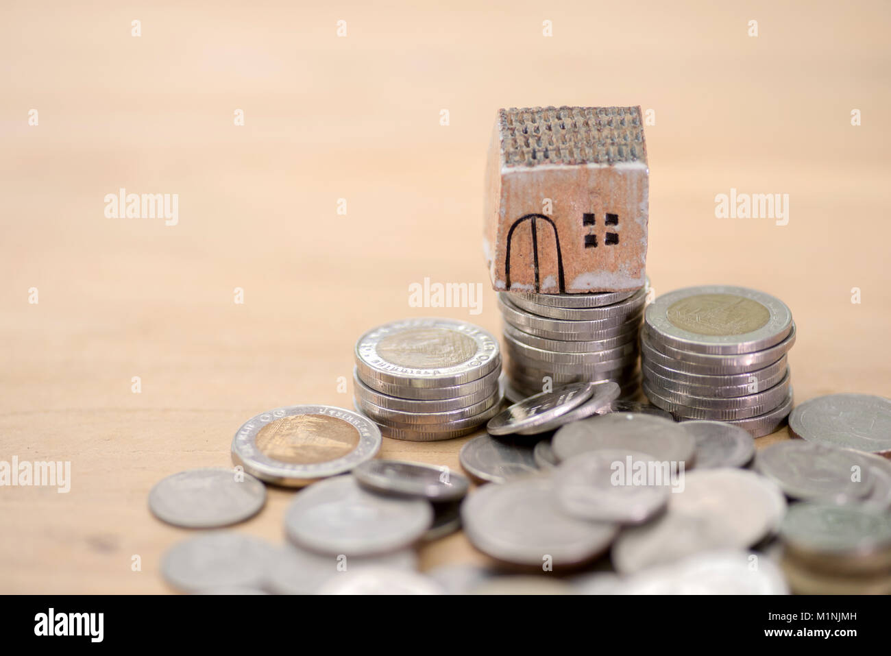 Mortgage concept. Money and house Stock Photo