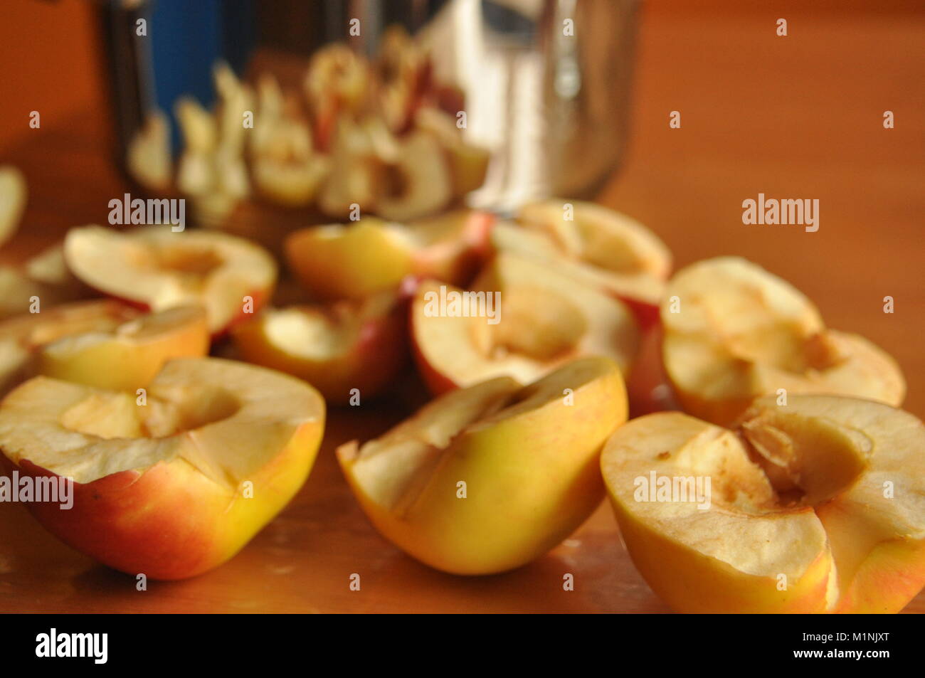 Sliced apples compote. Pot for preparing a beverage Stock Photo - Alamy