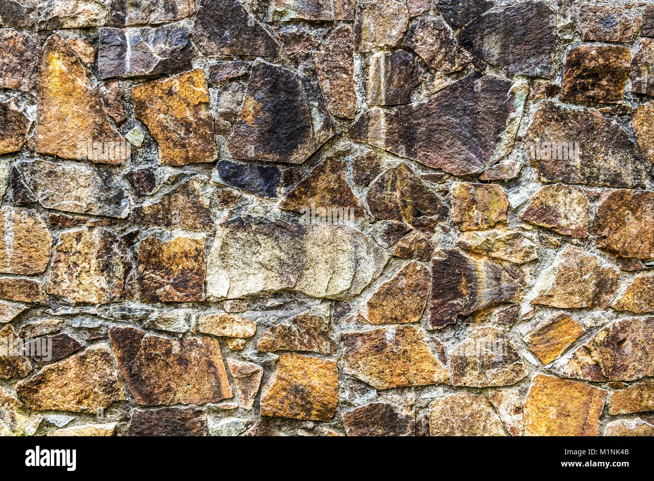 An old stone wall of an ancient fortress close up Stock Photo - Alamy