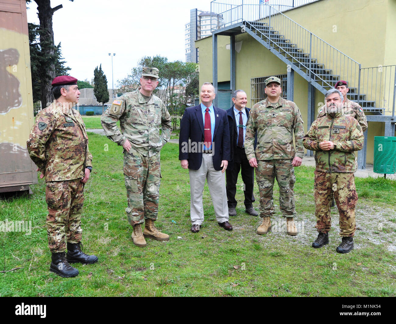 (From left) 1 Mar LGT Giuseppe Tringale, Folgore (ABN) Brigade Headquarters Plans Noncommissioned Officer, Sgt. Maj. Anthony R. Valdez, 7 Army Training Command G-3 Sergeant Major, James V. Matheson, Chief Regional Training Support Division South, 7th Army Training Command, Ivano Trevisanutto, Chief Training Support Center Italy, 7th Army Training Command, Lt. Col. Ismael B. Natividad, Training Support Activity Europe (TSAE) Director, Col. Marco Becherini, Folgore (ABN) Brigade Training Center Commander, visit Lustrissimi Training Area, Livorno, Italy, Jan 30, 2018.( Stock Photo