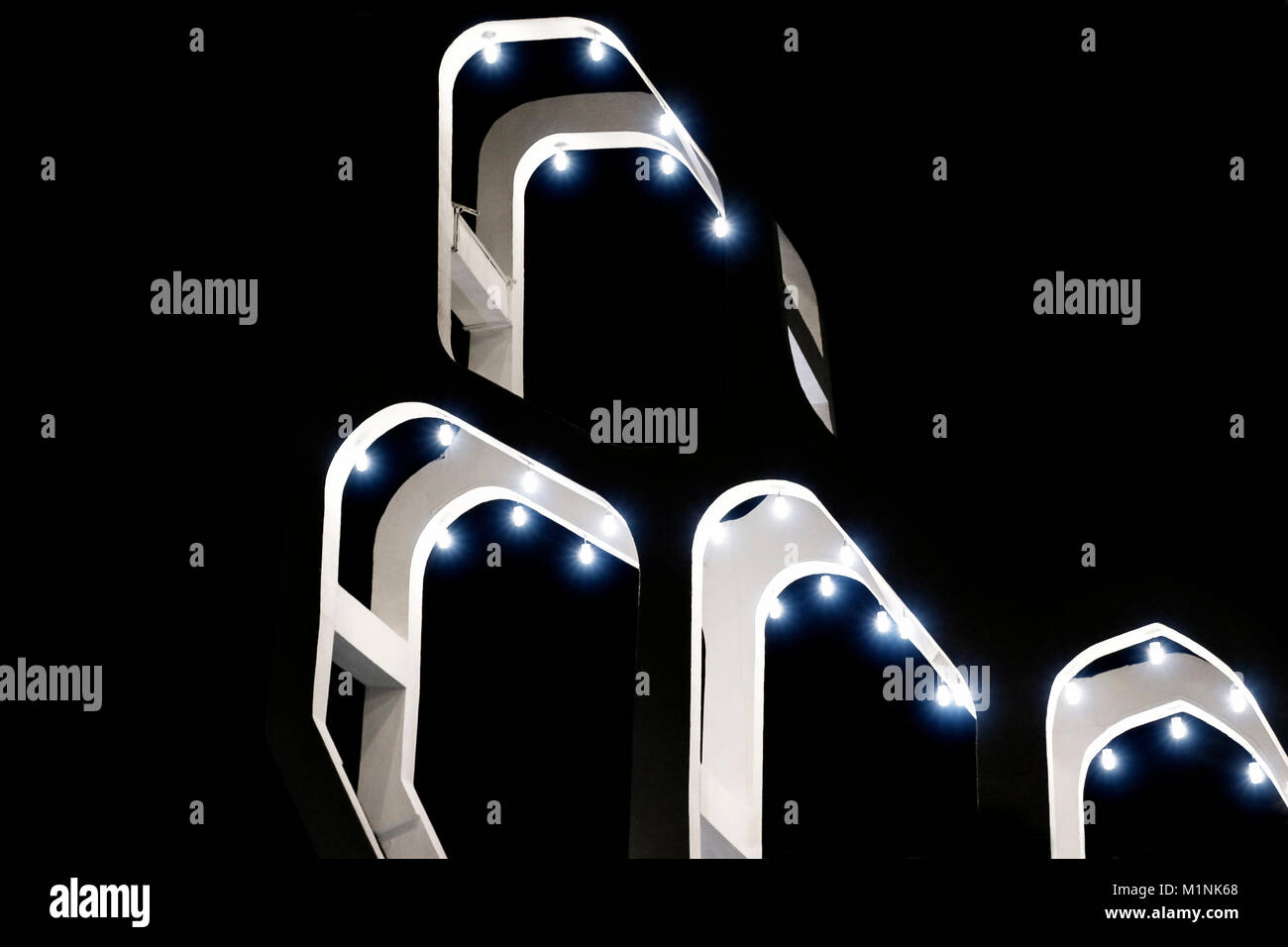 Futuristic High Risers Futuristic modern high-rise building at night Stock Photo - Alamy