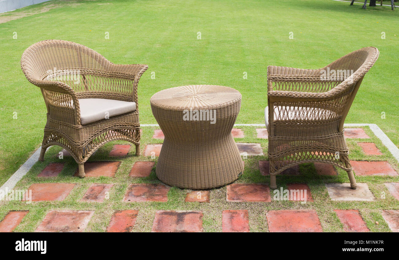 Lounge area two chairs for guests outside with green grass Stock Photo