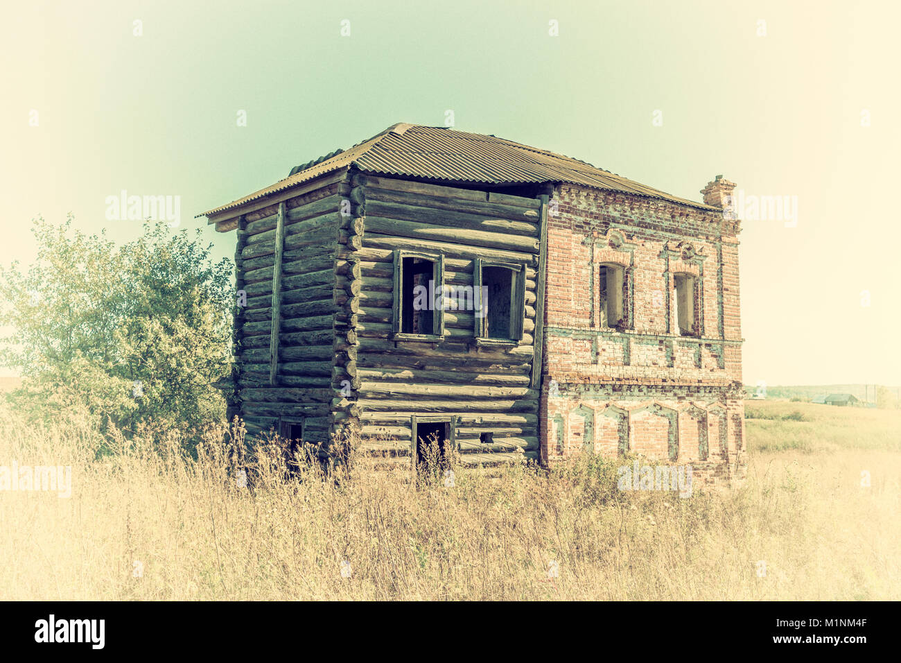 The Old Abandoned Historic Building Of Red Brick And Logs In The