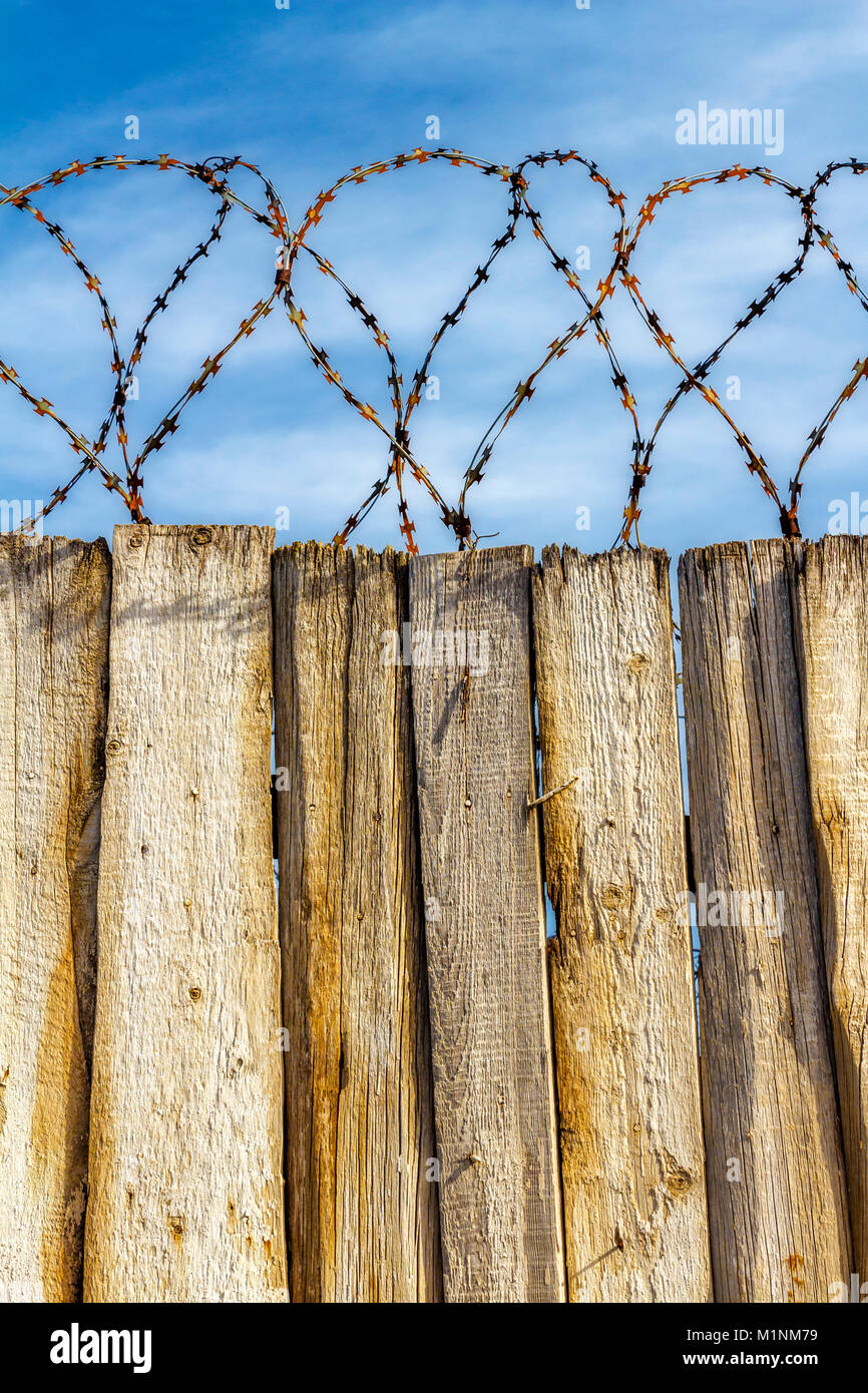 Barbed wire on the fence area with restricted access Stock Photo Alamy