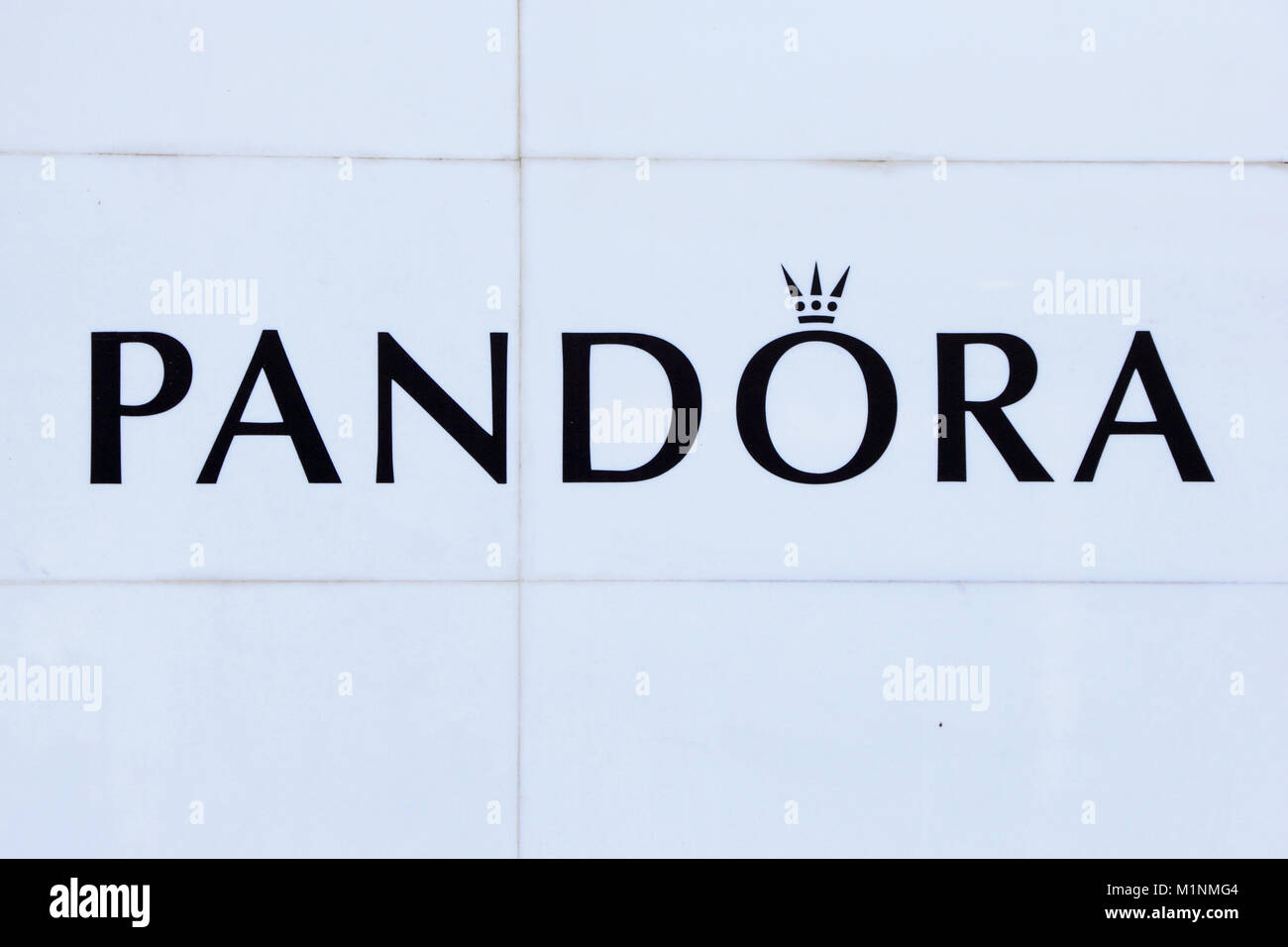Pandora logo on white tiles Stock Photo - Alamy