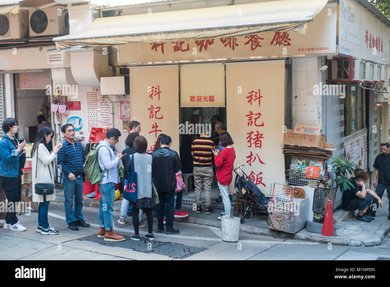 Hong Kong restaurant standing in a line Stock Photo