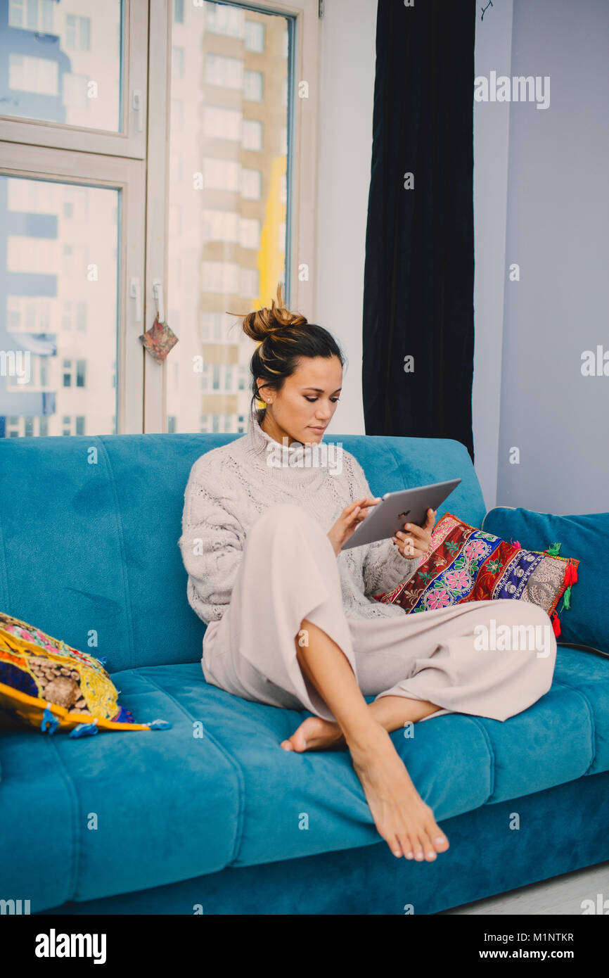Teenage girl sitting sofa hi-res stock photography and images - Alamy