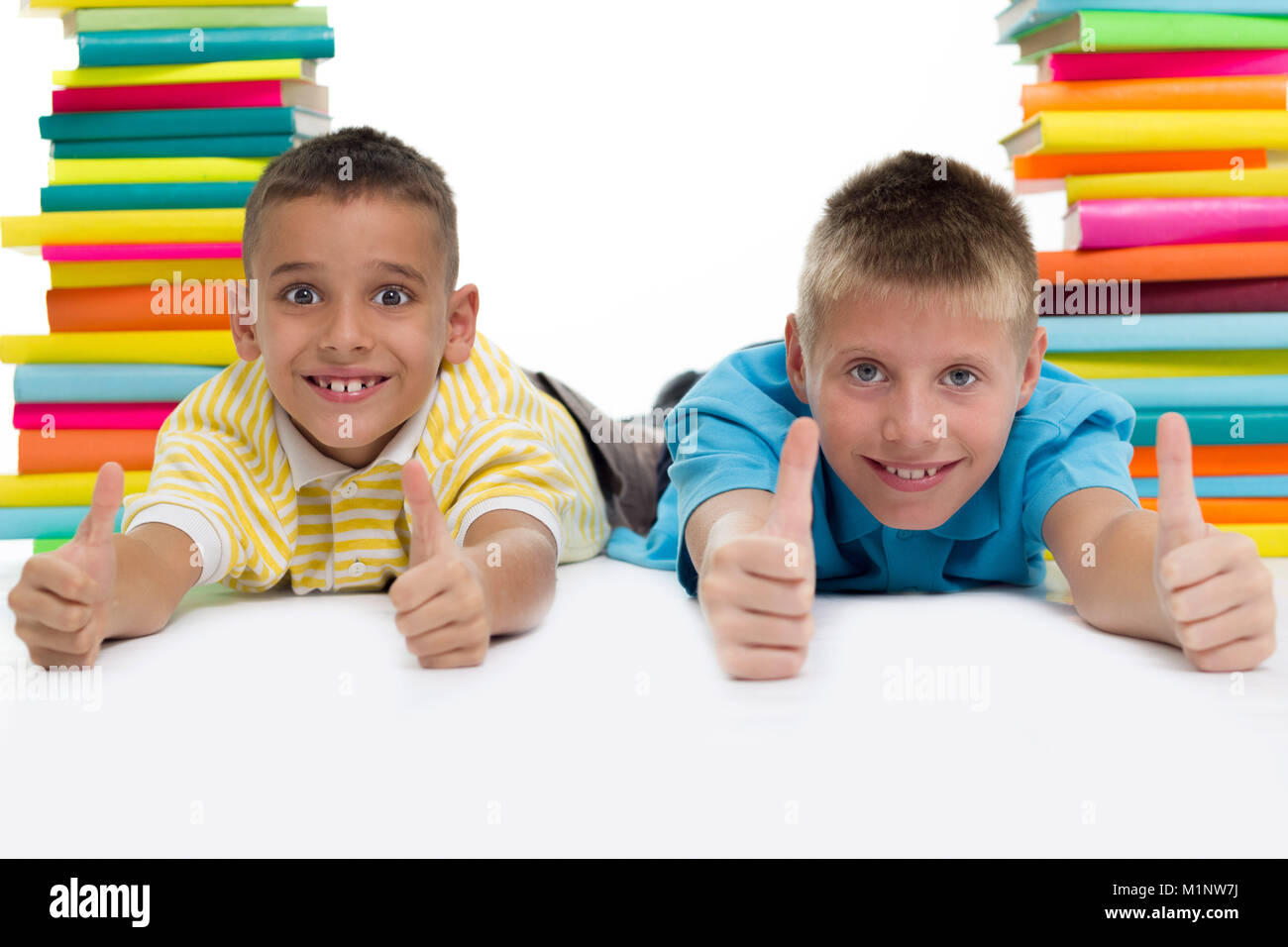 two boys surrounded with books Stock Photo
