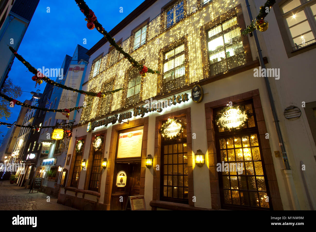 Germany, Cologne, the restaurant Haxenhaus zum Rheingarten in the historic part of the town, Christmas lighting.   Deutschland, Koeln, das Restaurant  Stock Photo