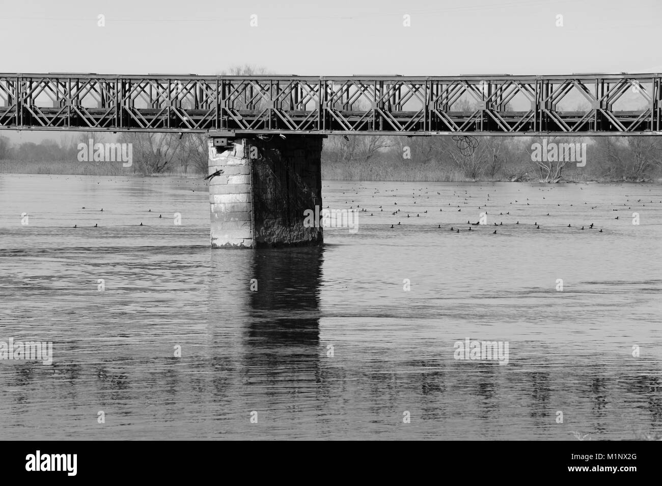 Old metal bridge over the river, Albania. Black and white, space for text Stock Photo
