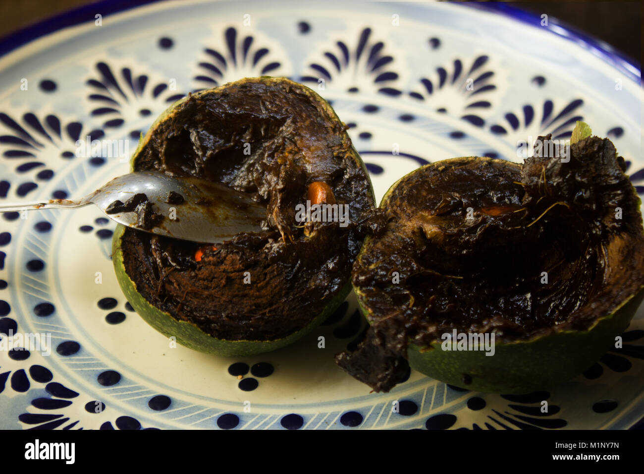 Black sapote pudding on a mexican talavera  plate, exotic fruit Stock Photo