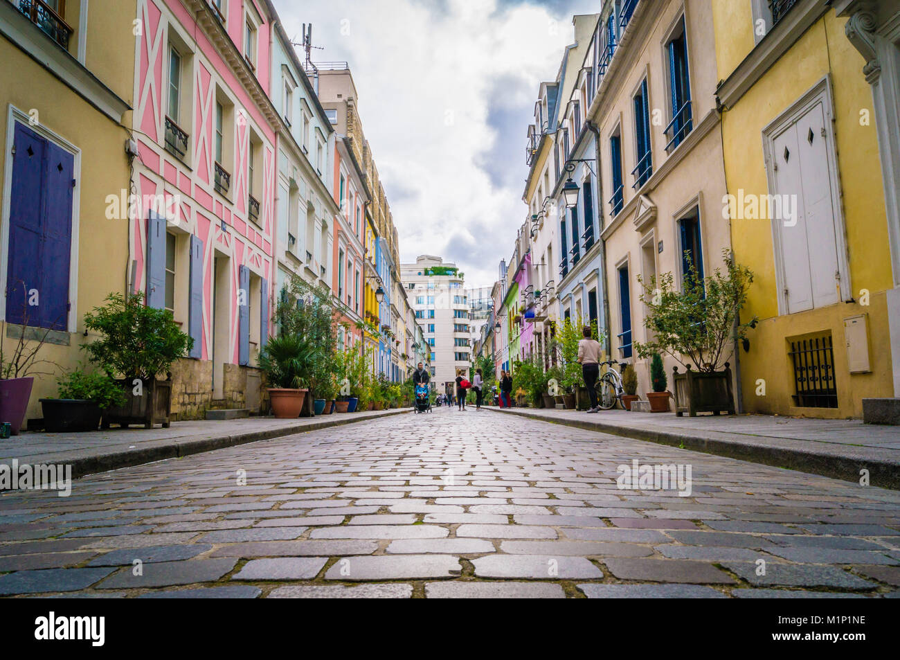 Cremieux street with its colored houses in Paris Stock Photo - Alamy