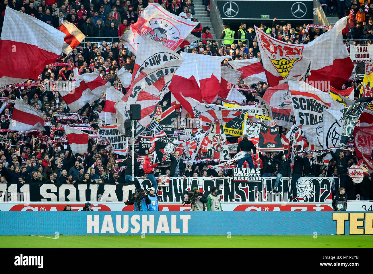 Fan section VfB Stuttgart,Ultras with flags in the Cannstatter Kurve,Mercedes-Benz Arena,Stuttgart,Baden-Württemberg Stock Photo
