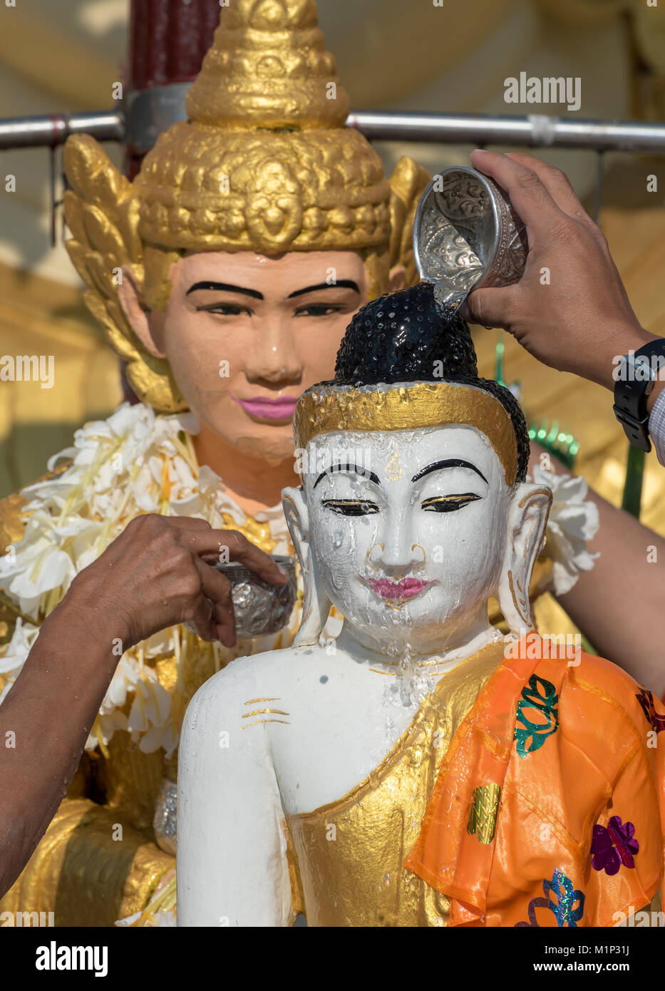 Ritual of pouring water over Buddha statue,Shwedagon Pagoda,Yangon