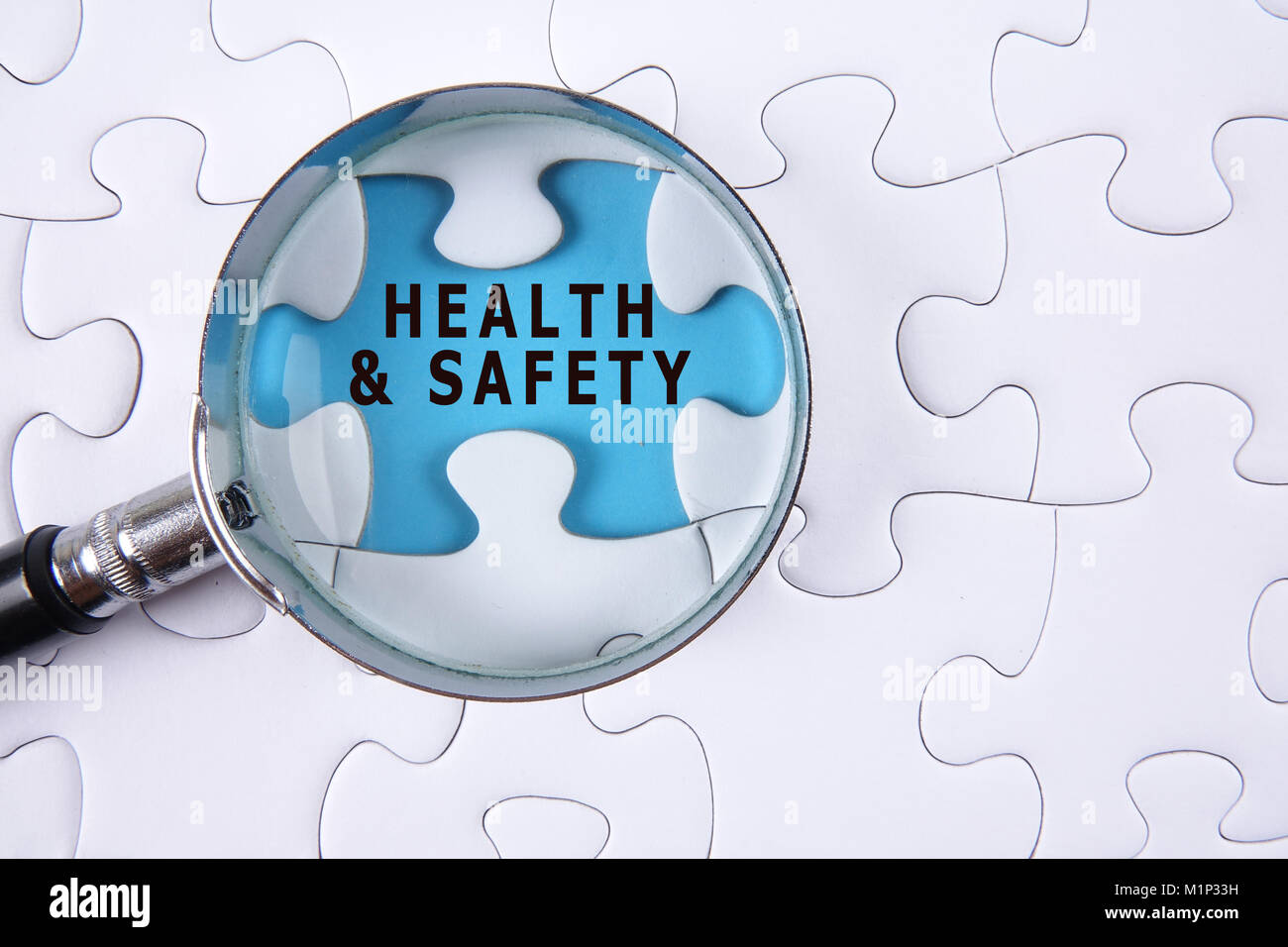 HEALTH AND SAFETY CONCEPT with white jigsaw puzzle Stock Photo Alamy
