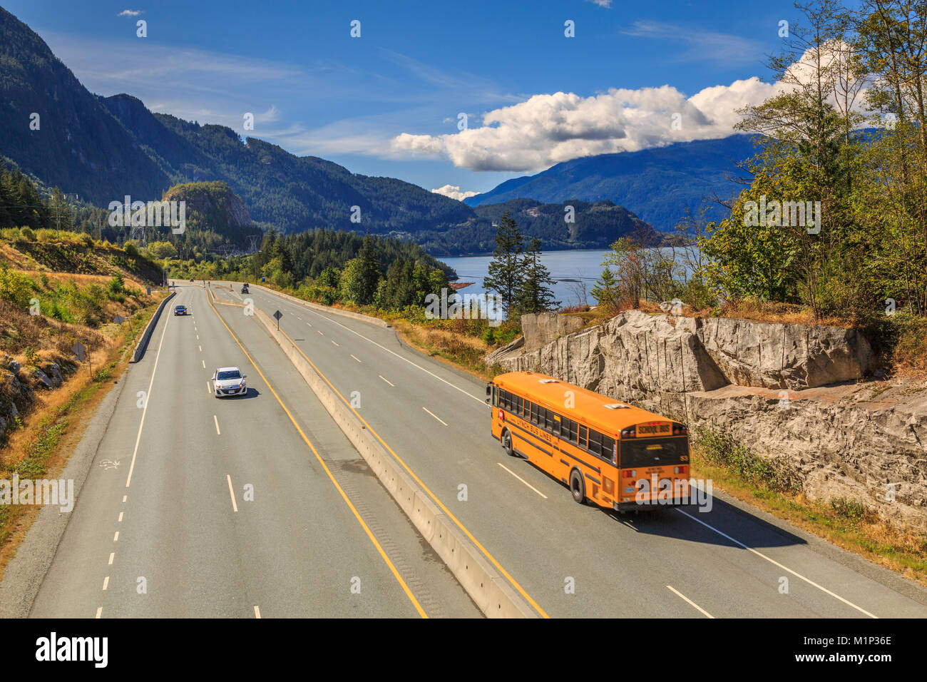 Yellow school bus on The Sea to Sky Highway near Squamish, British Columbia, Canada, North America Stock Photo