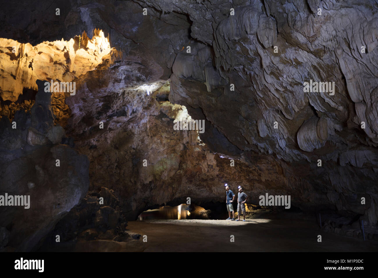 Hikers in the interior of Galaxy cave on the Ben Dang River in Thien Ha, Ninh Binh, Vietnam, Indochina, Southeast Asia, Asia Stock Photo
