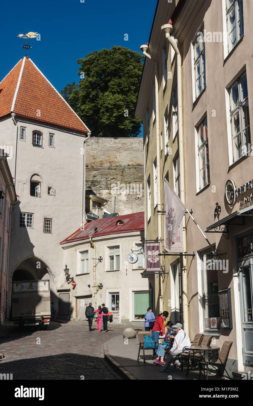 Visitors wander in streets off Town Hall Square on way to Toomea Hill, Old Town, UNESCO World Heritage Site, Tallinn, Estonia, Europe Stock Photo