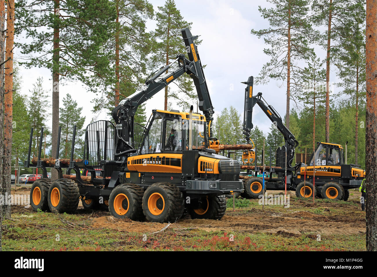 JAMSA, FINLAND - AUGUST 29, 2014: Unidentified professionals take part in the National Forest Machine Operator Competition, held at FinnMETKO 2014. Stock Photo