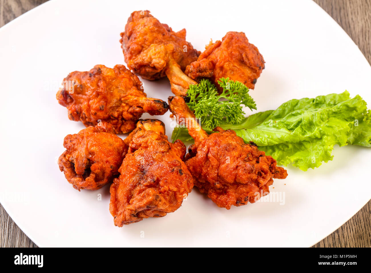 Indian traditional cuisine Chicken lollipops with spices Stock Photo