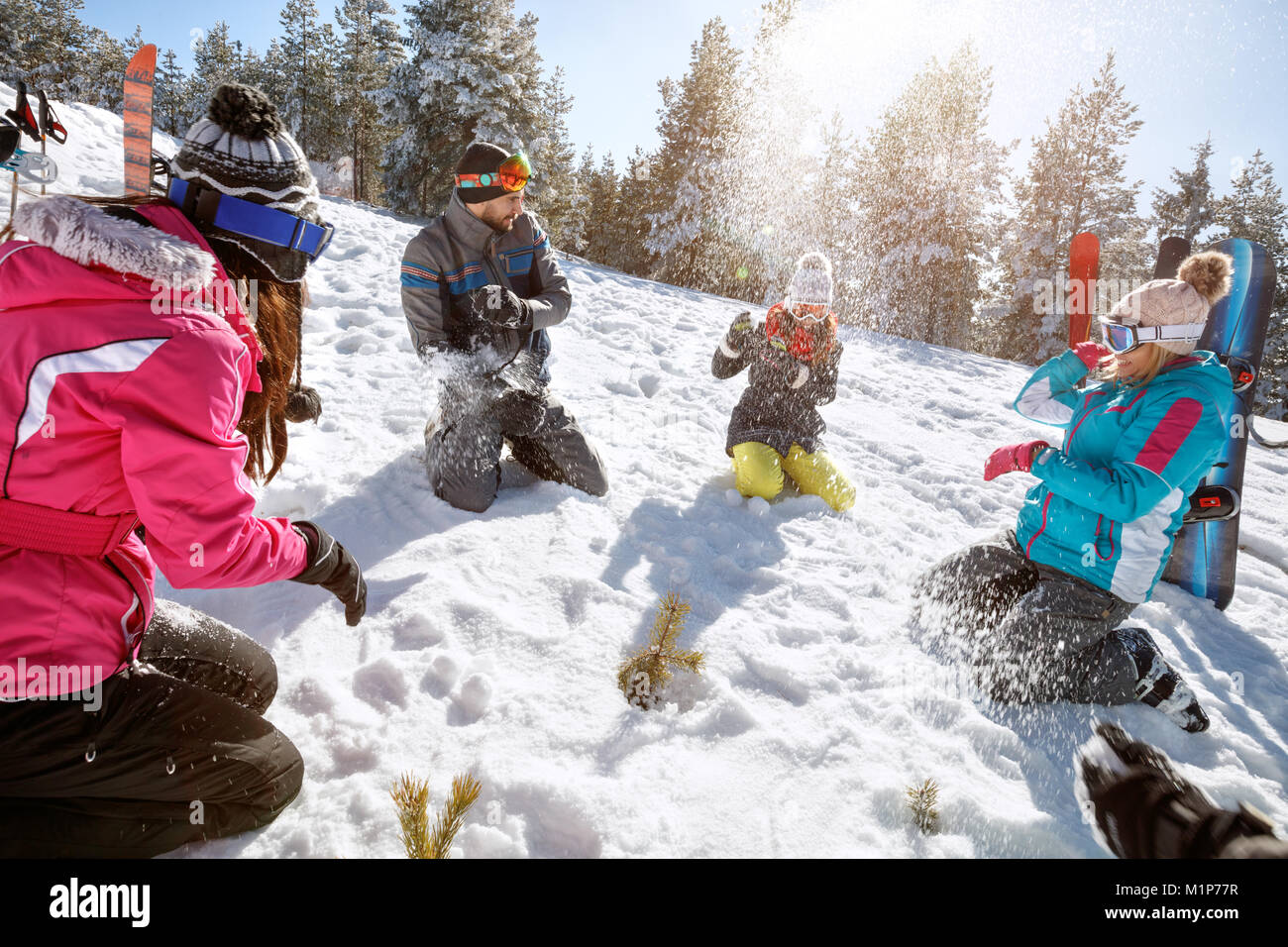 Young friends snowballing and enjoying Stock Photo