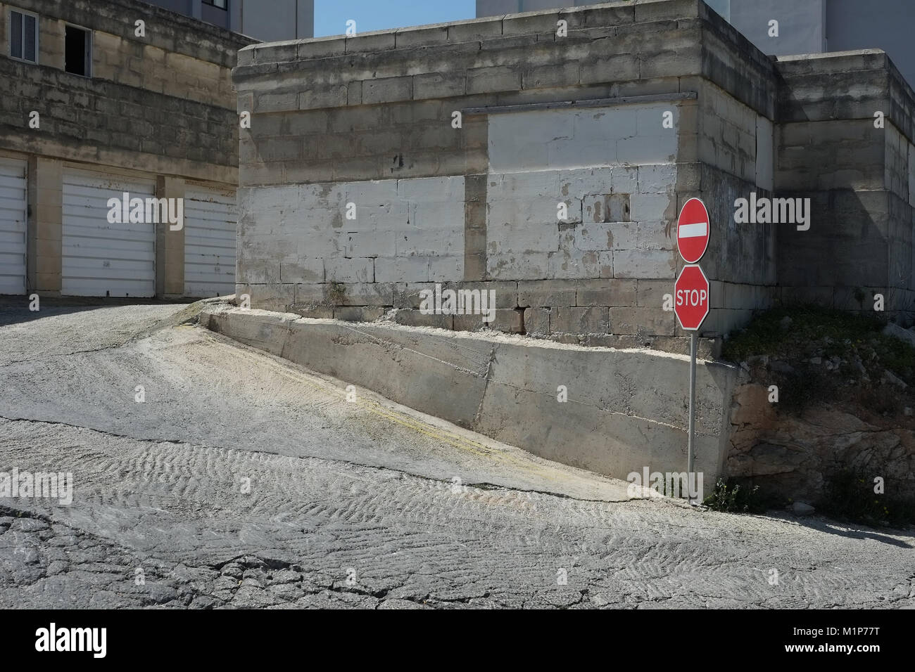Concrete buildings and stop sign, Paceville, Malta Stock Photo