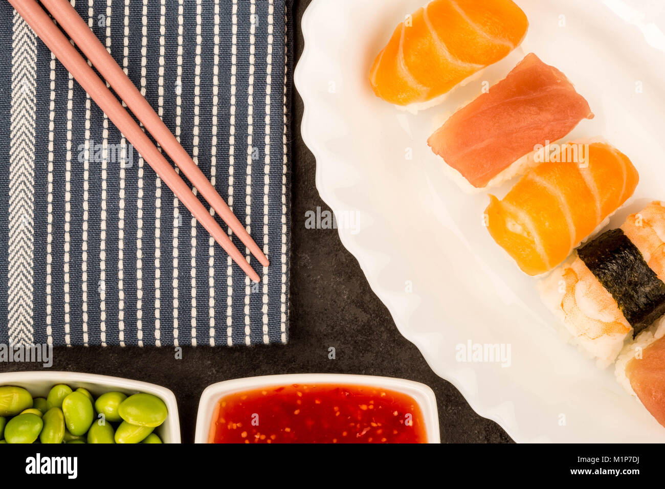 Japanese Style Prawn Salmon And Tuna Nigiri Sushi Against A Black Background Stock Photo