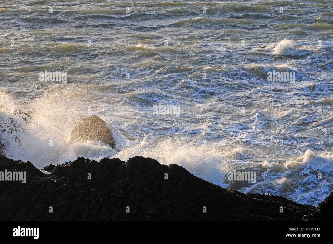 Rising tide at Gwbert, Ceredigion. sunset Stock Photo