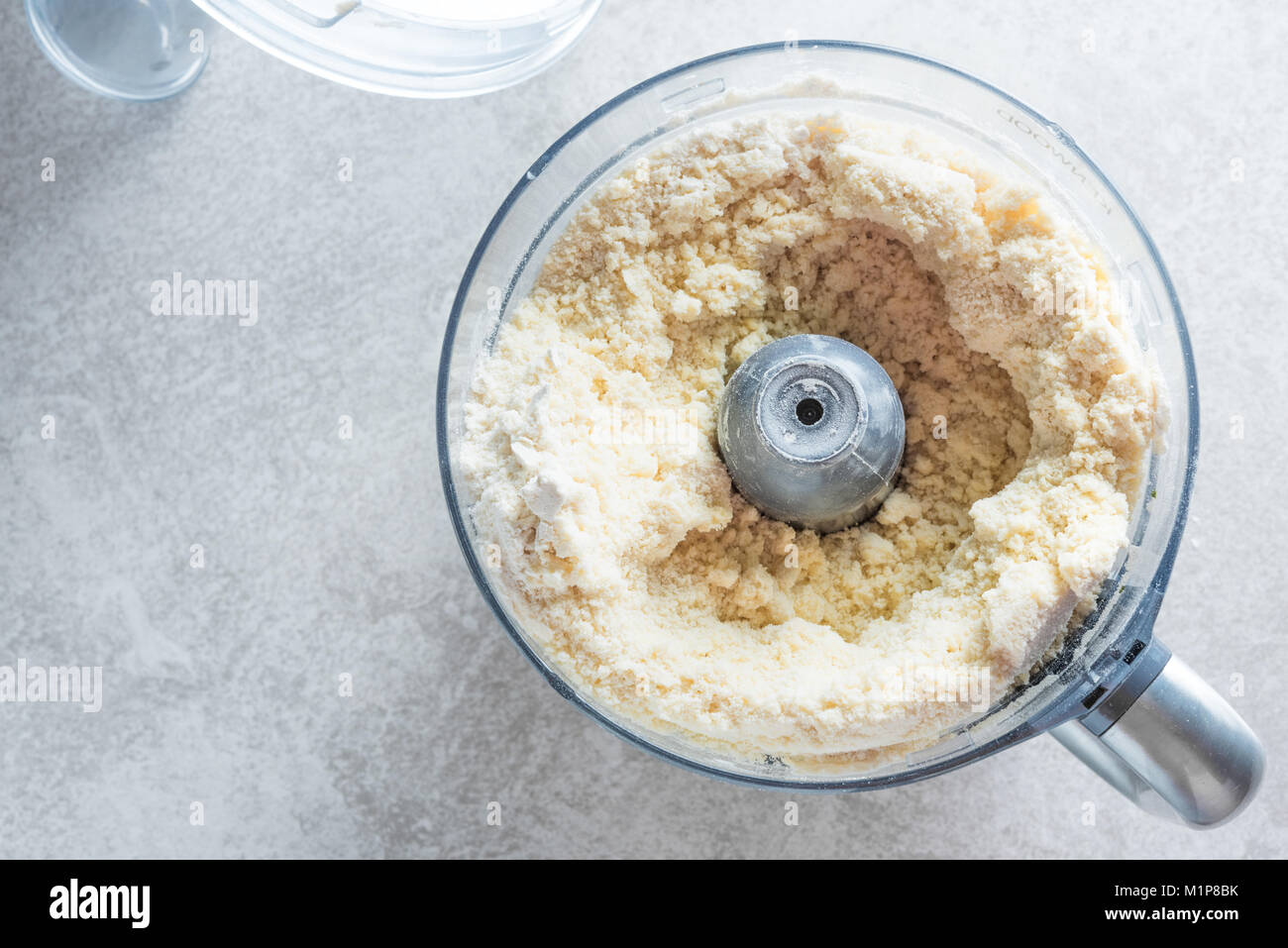 Dough prepaing in a food processor. Batter making fast and easy Stock