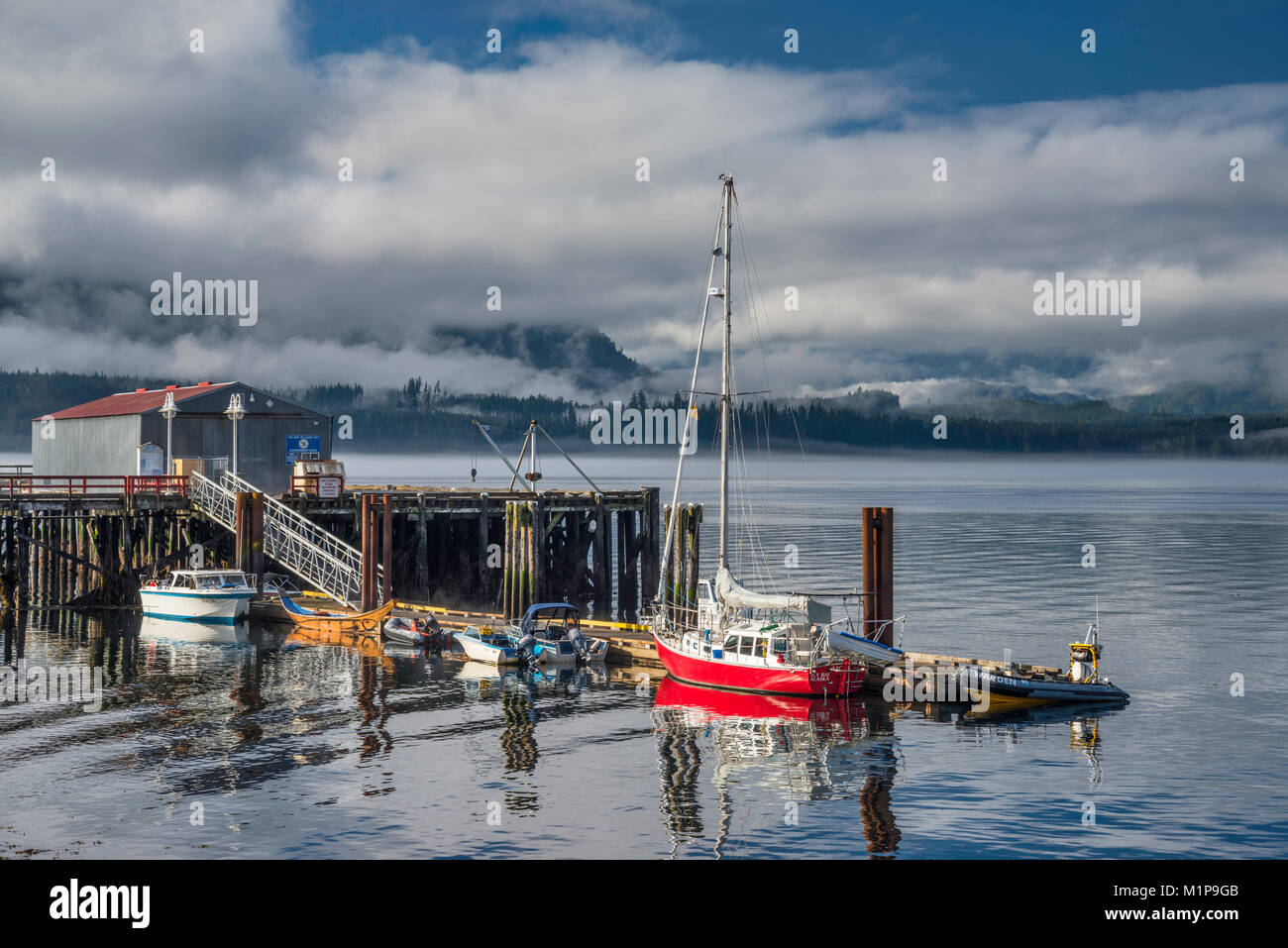 Boats at Boat Harbour, Vancouver Island shore in background, village of ...