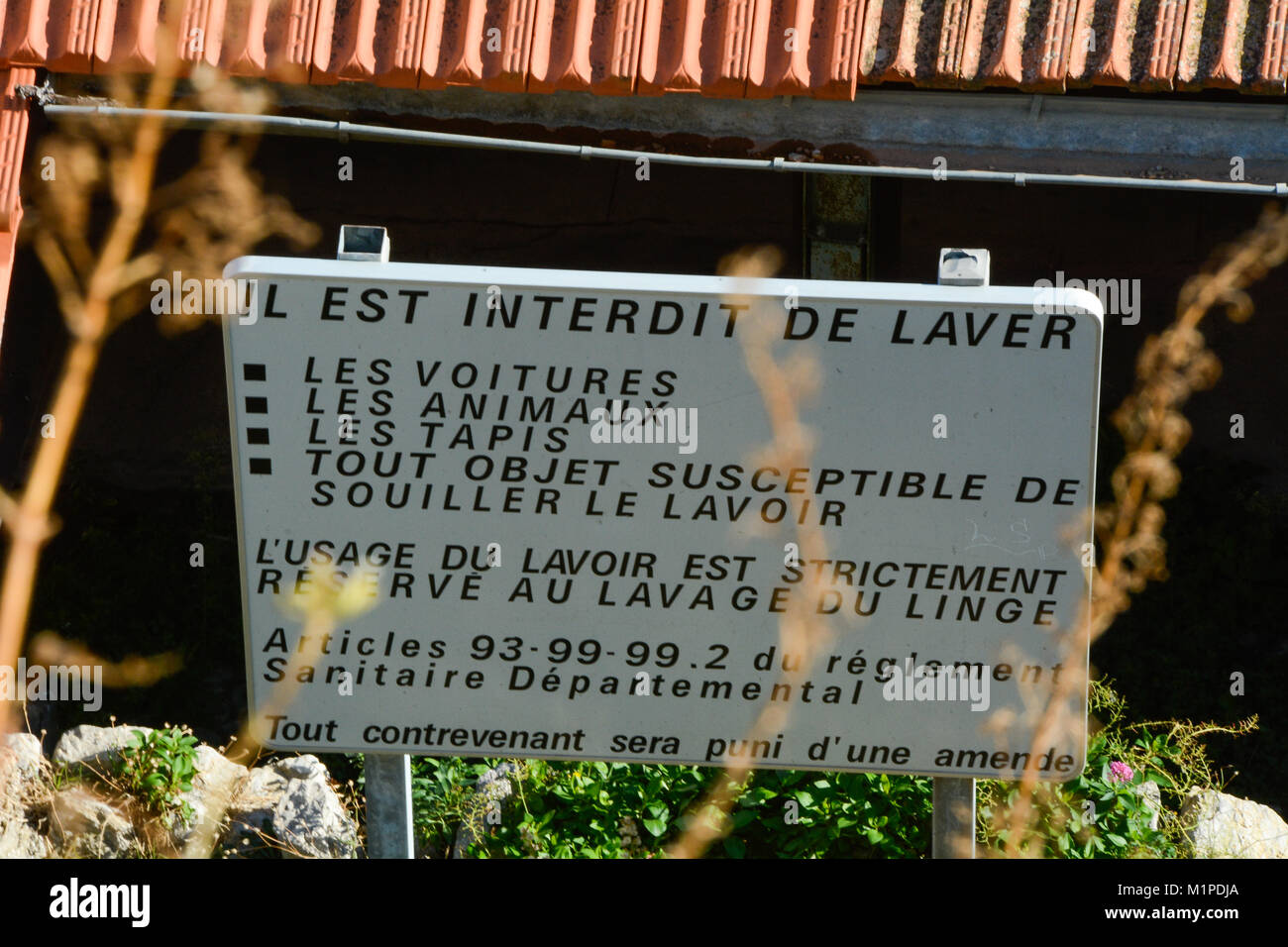 A notice for the rules of a laundry in Hyeres, France Stock Photo Alamy