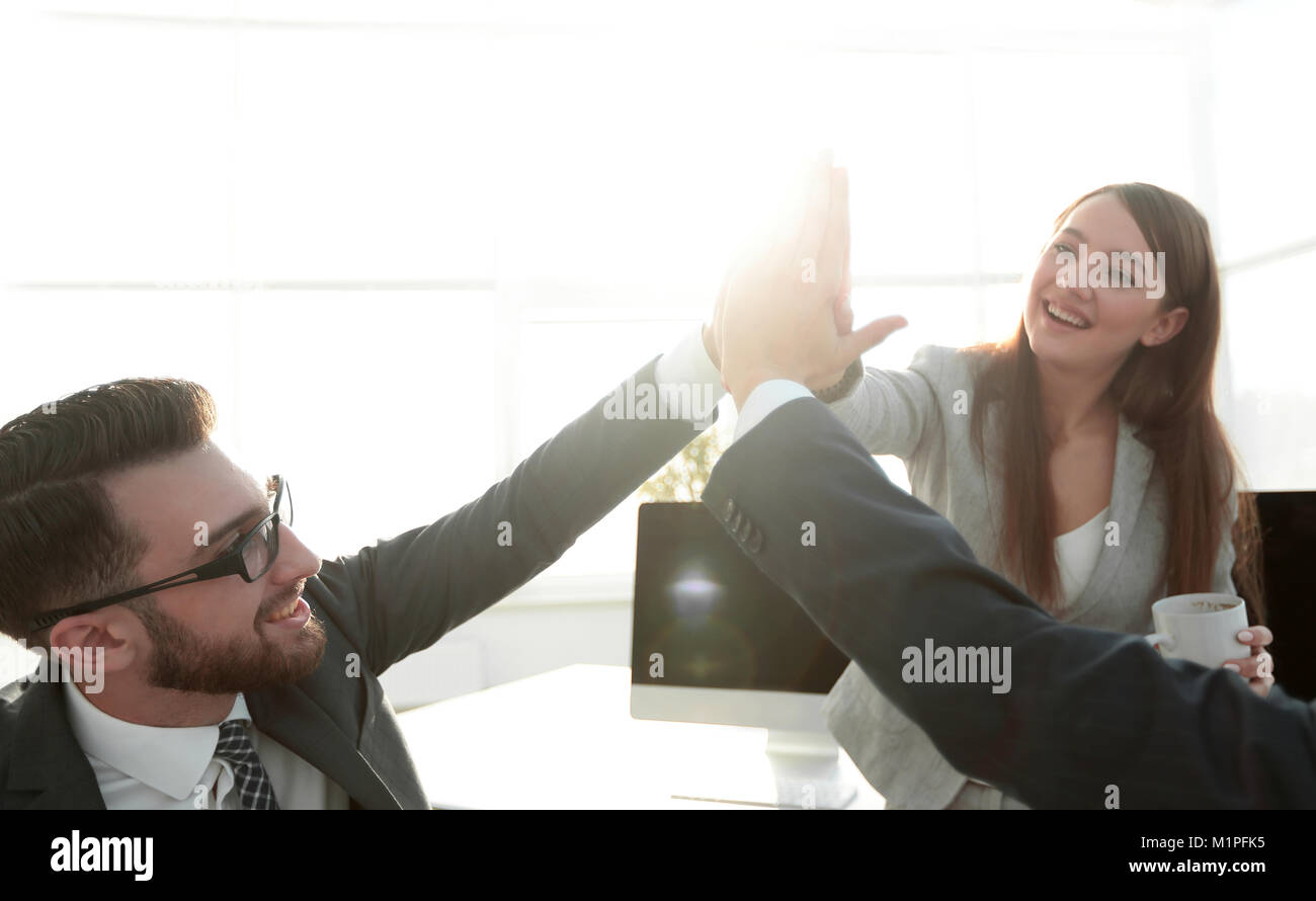 business team giving each other a high five Stock Photo - Alamy